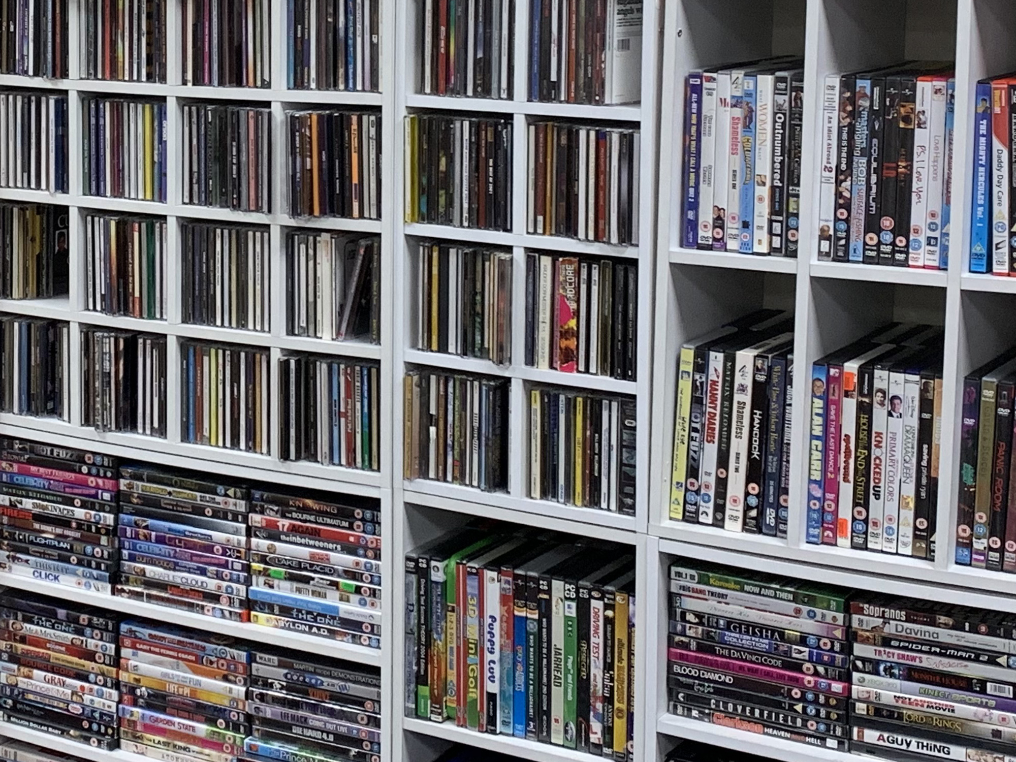 CD and DVDs in shelves at Sense Scotland charity shop - donate to our shops