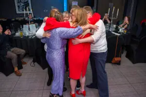 Group hug at the Sense Scotland Staff and Volunteer Awards